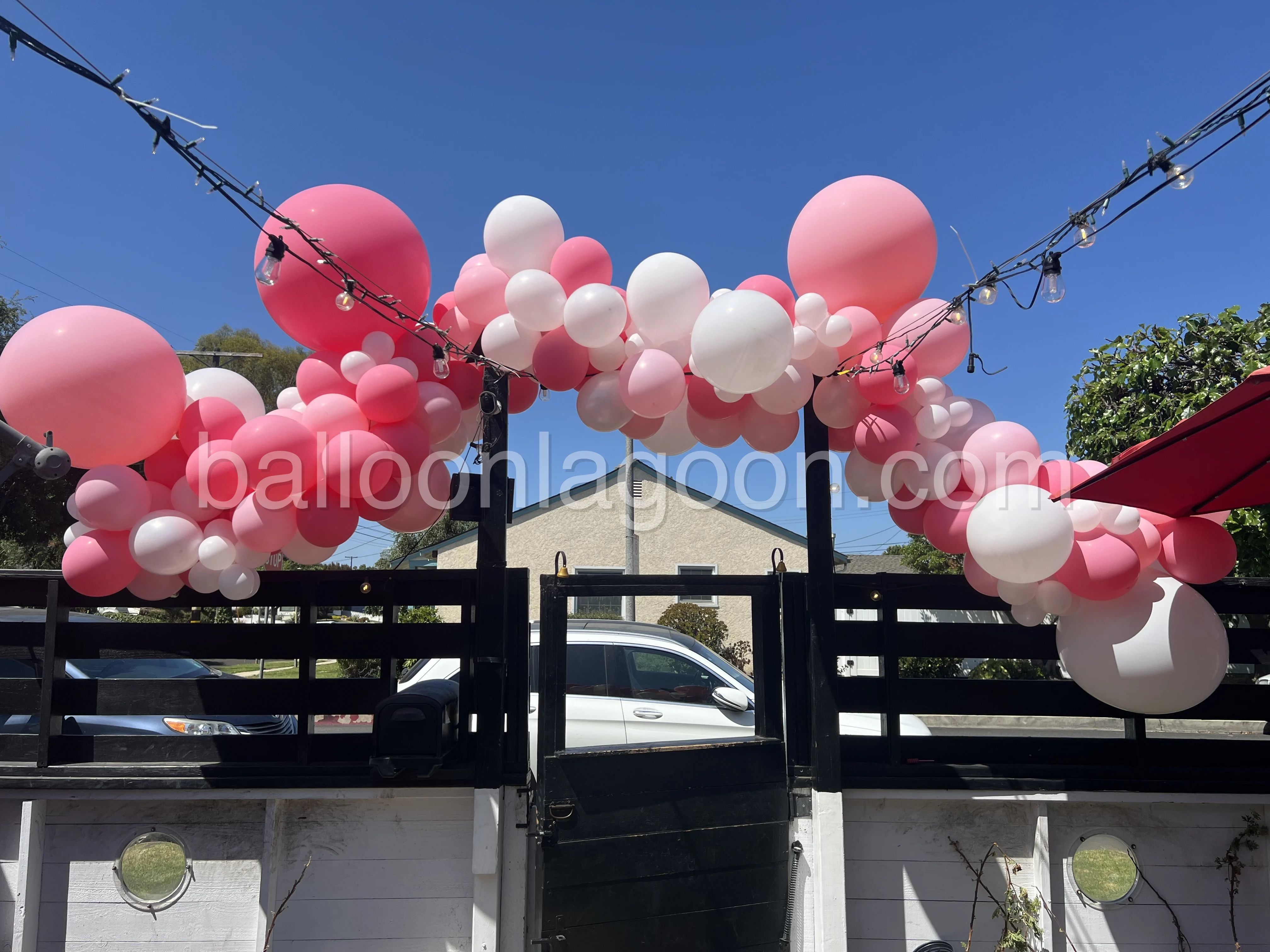 Organic balloon arch and decor for a Los Angeles patio event